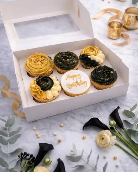 Black and gold birthday cupcakes